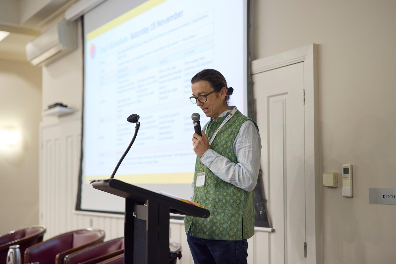 Facilitator presenting to participants during conference session