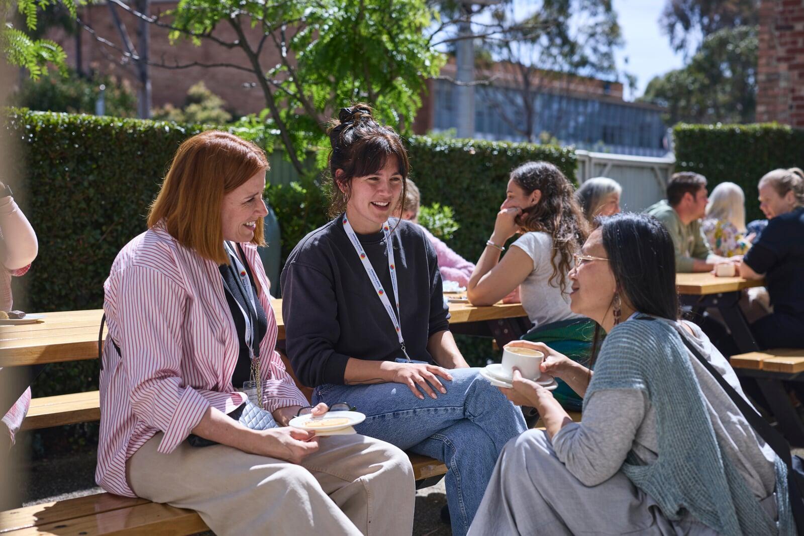 Conference participants talking together during a break